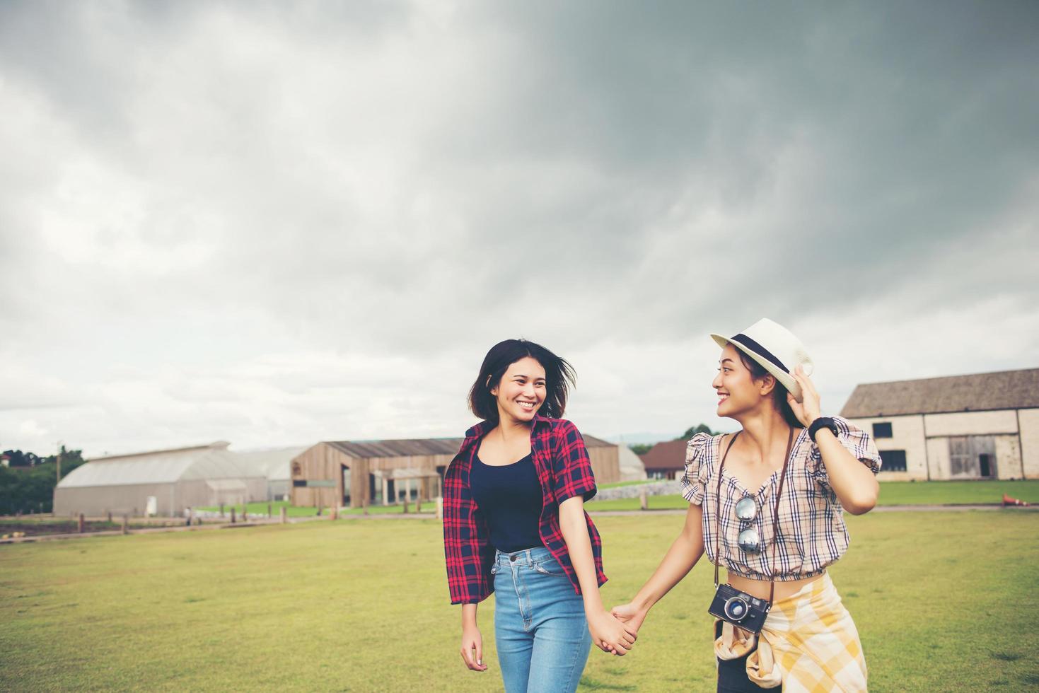 Portrait of smiling girls walking in the park photo