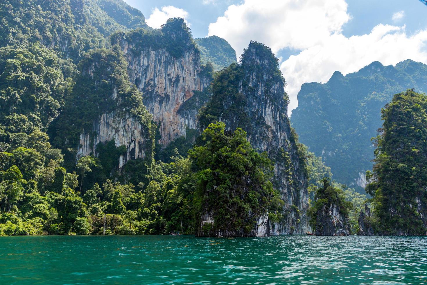 Mountains and water with cloudy blue sky photo