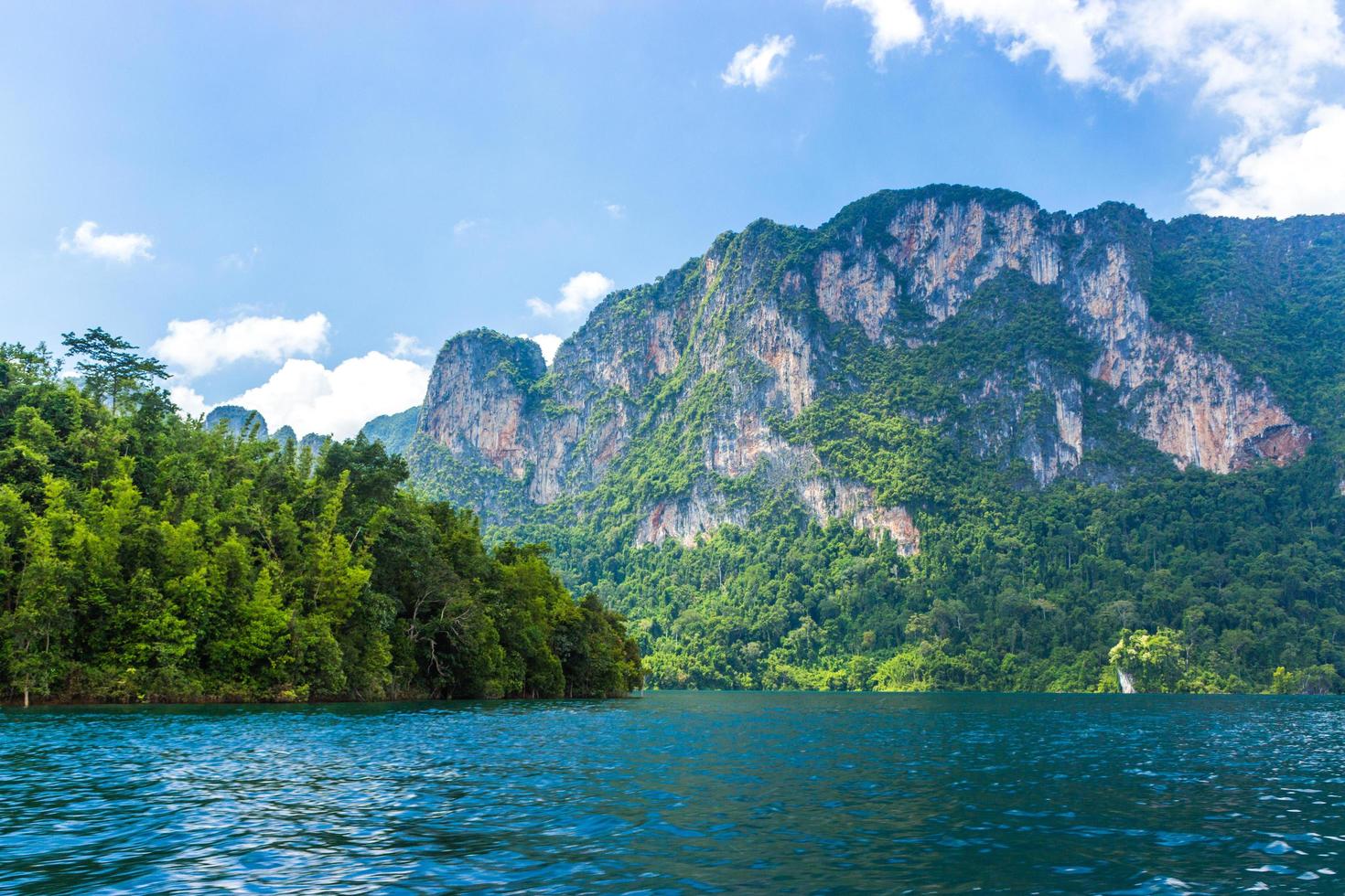 Mountains and lake with cloudy blue sky photo