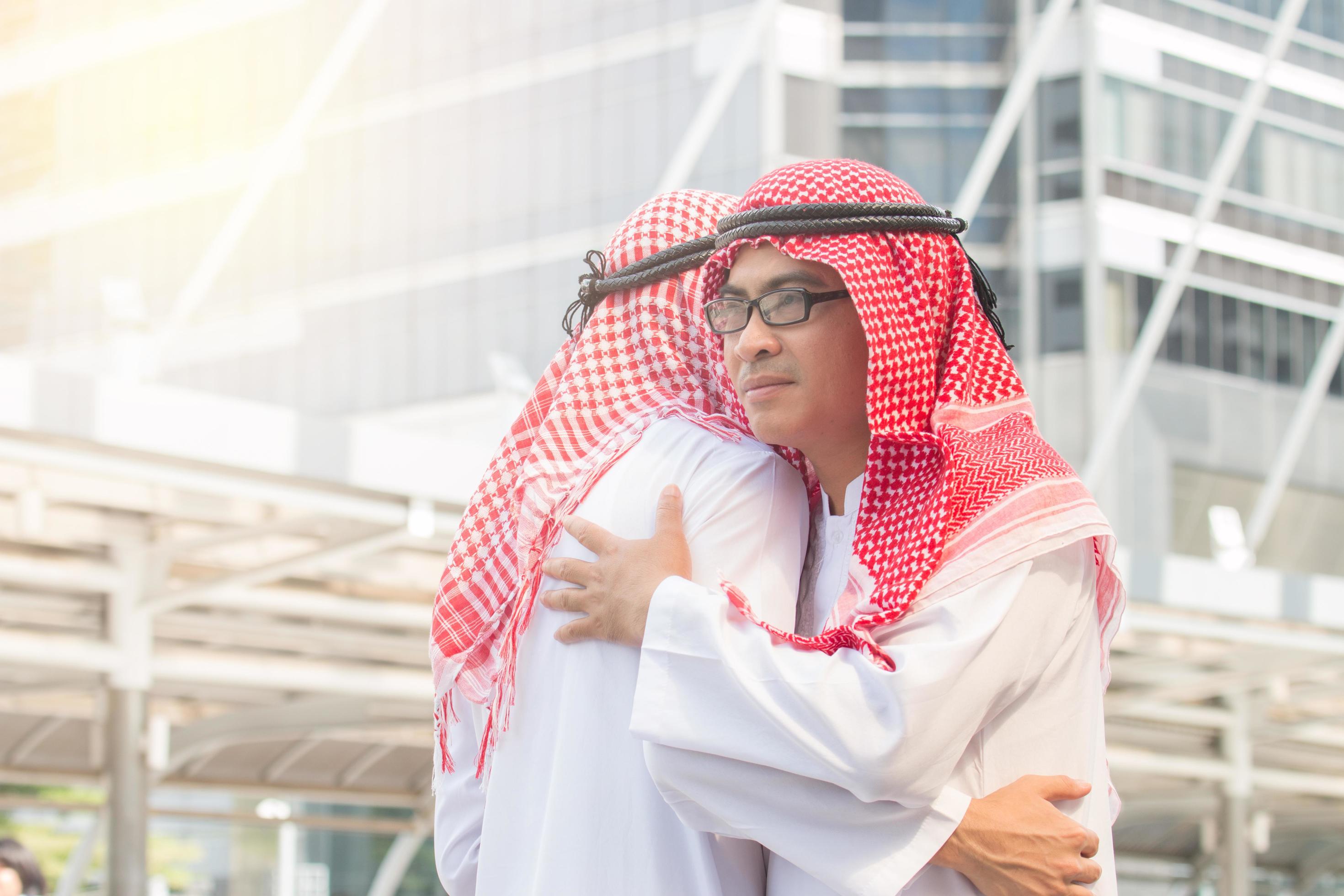 Arab business people hugging each other 1900962 Stock Photo at Vecteezy