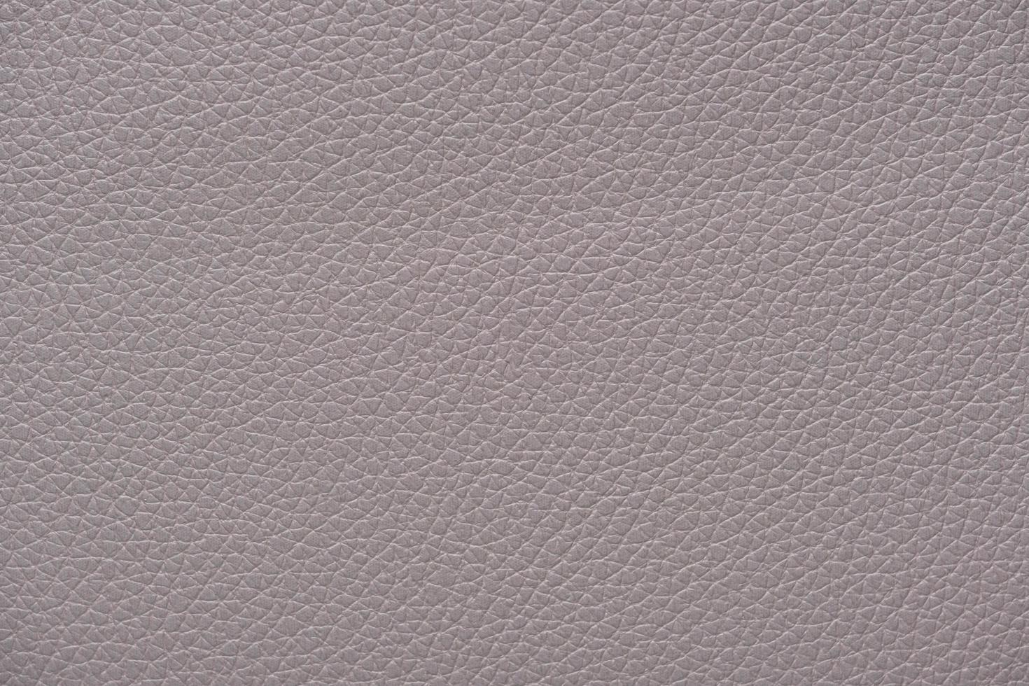 Extremely close-up light grey leather texture background surface photo