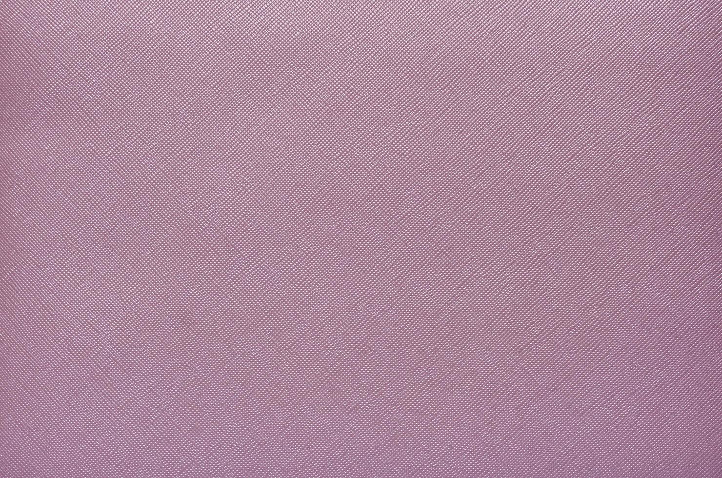 Purple background from a textile material with wicker pattern, closeup. photo