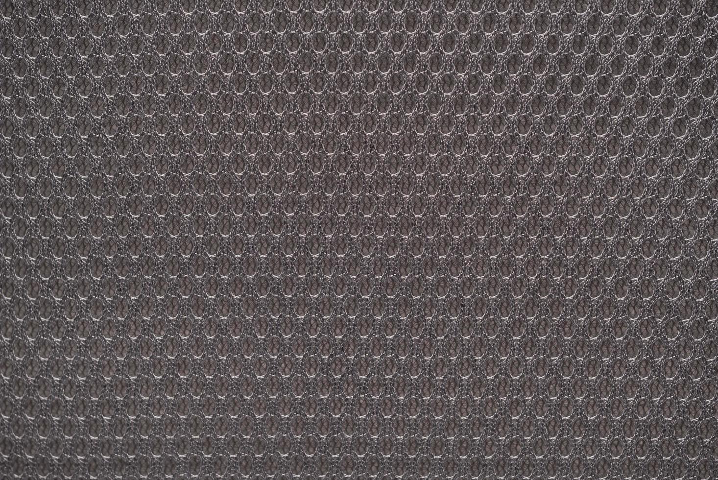 Grey nylon fabric textured background with hexagonal shape photo