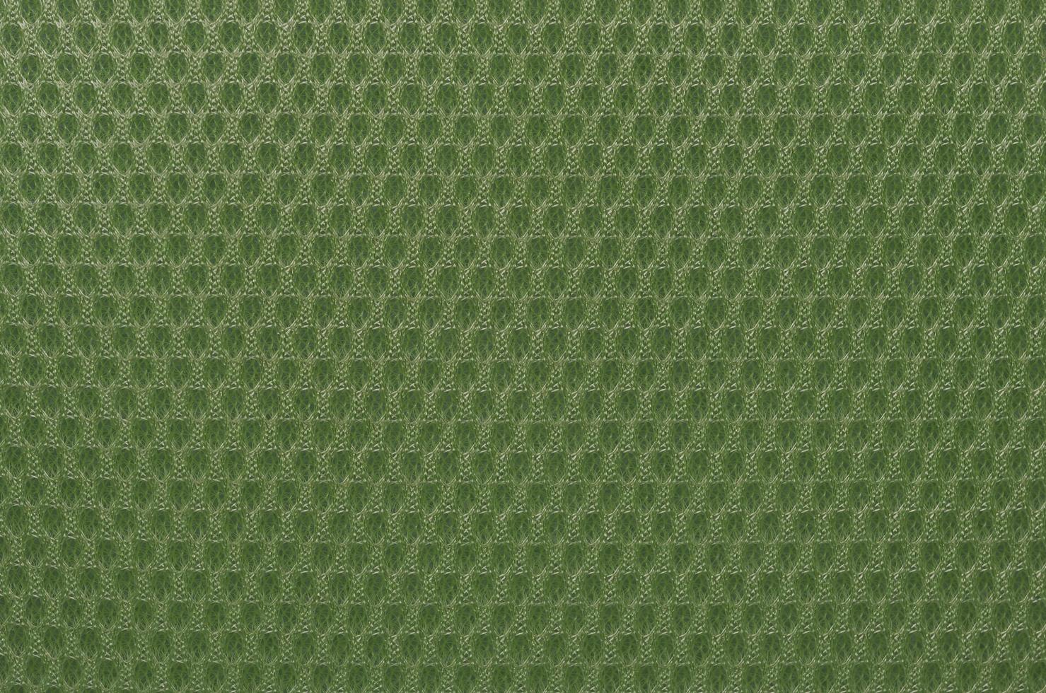 Green nylon fabric textured background with hexagonal shape photo