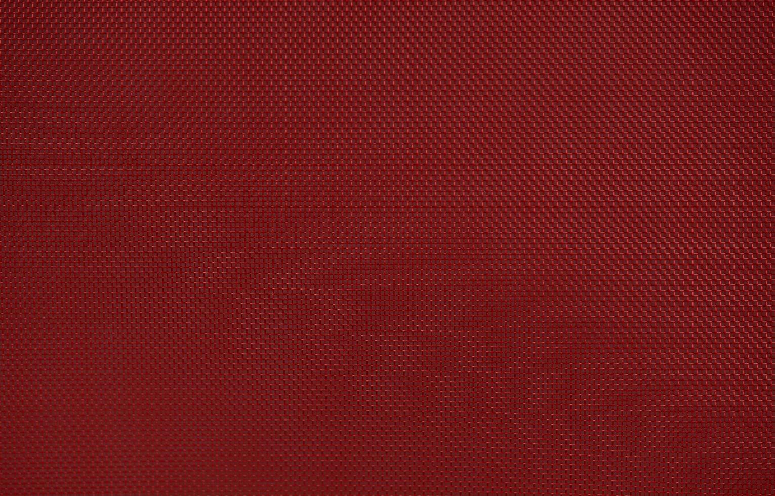 Red nylon fabric textured background with hexagonal shape photo