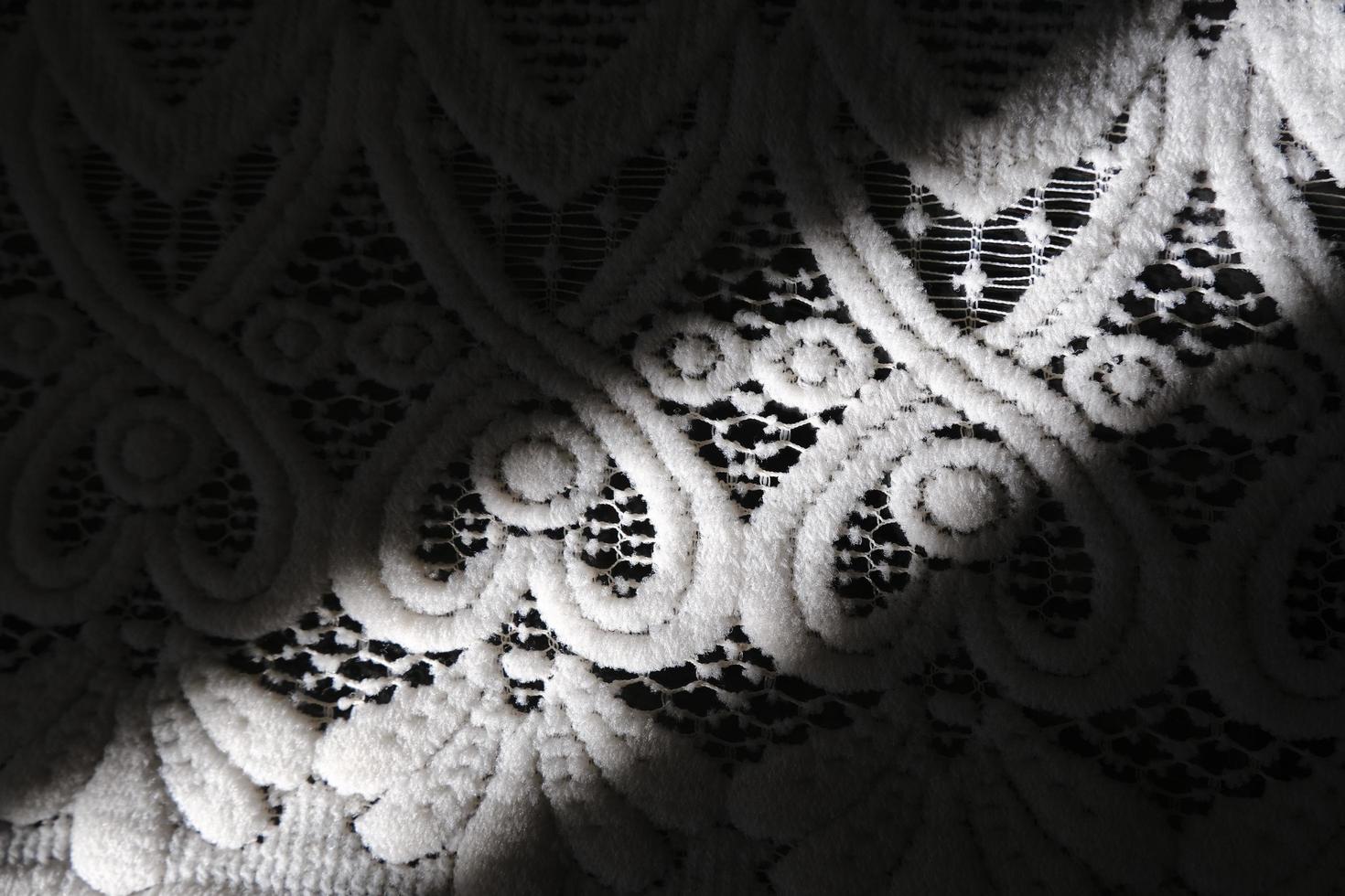 Lace pattern tablecloth with a shadow photo