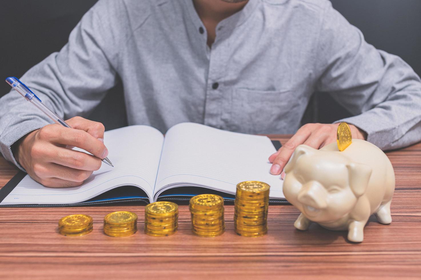 Man with stacked coins photo