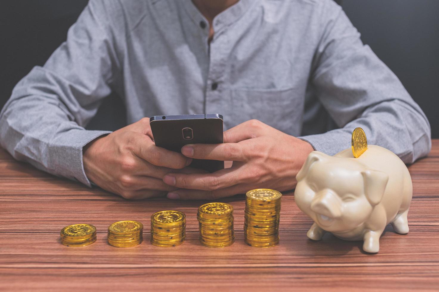 Man with stacked coins photo