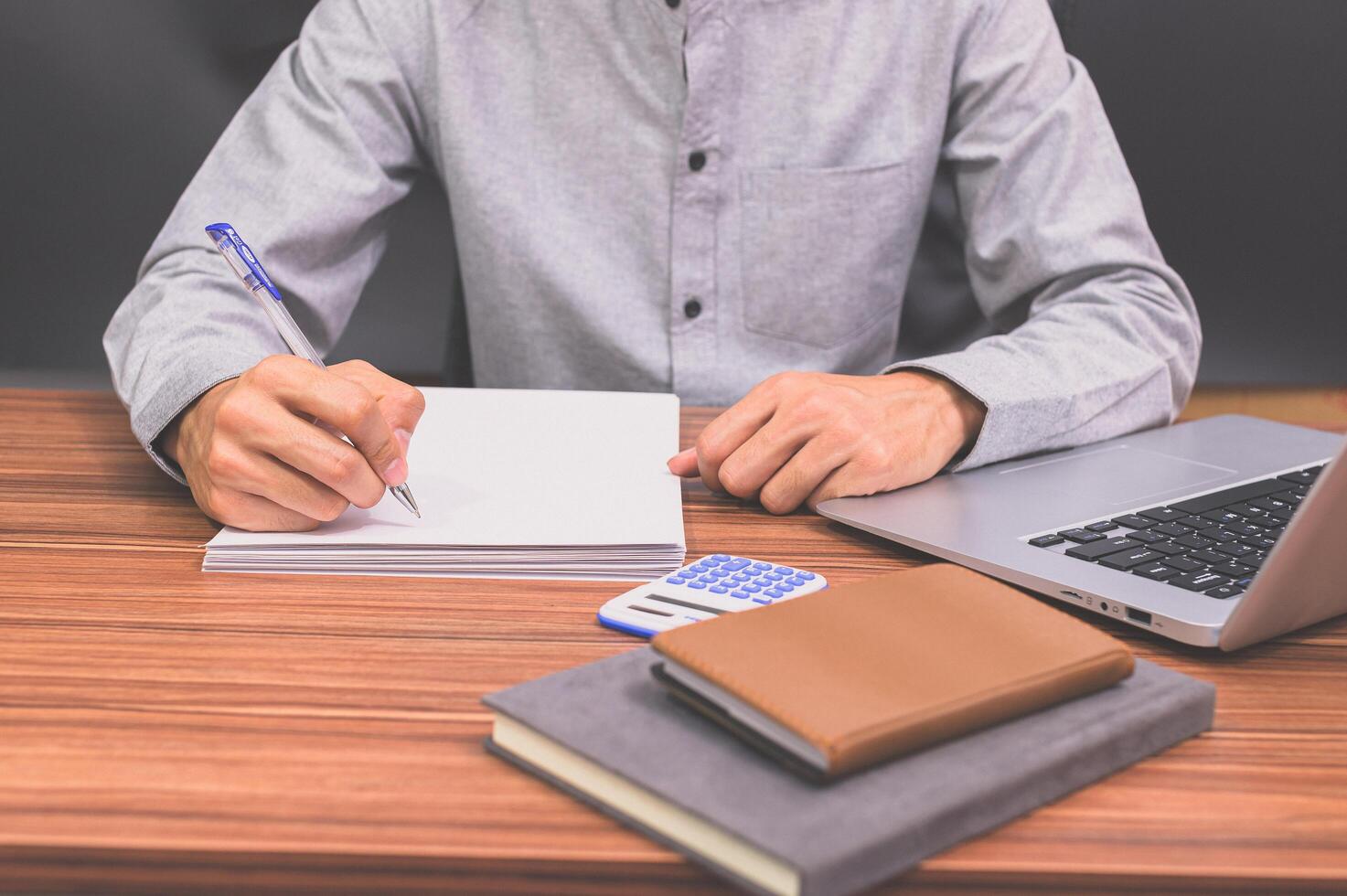 Business people sit at work and check documents At the desk in the room photo