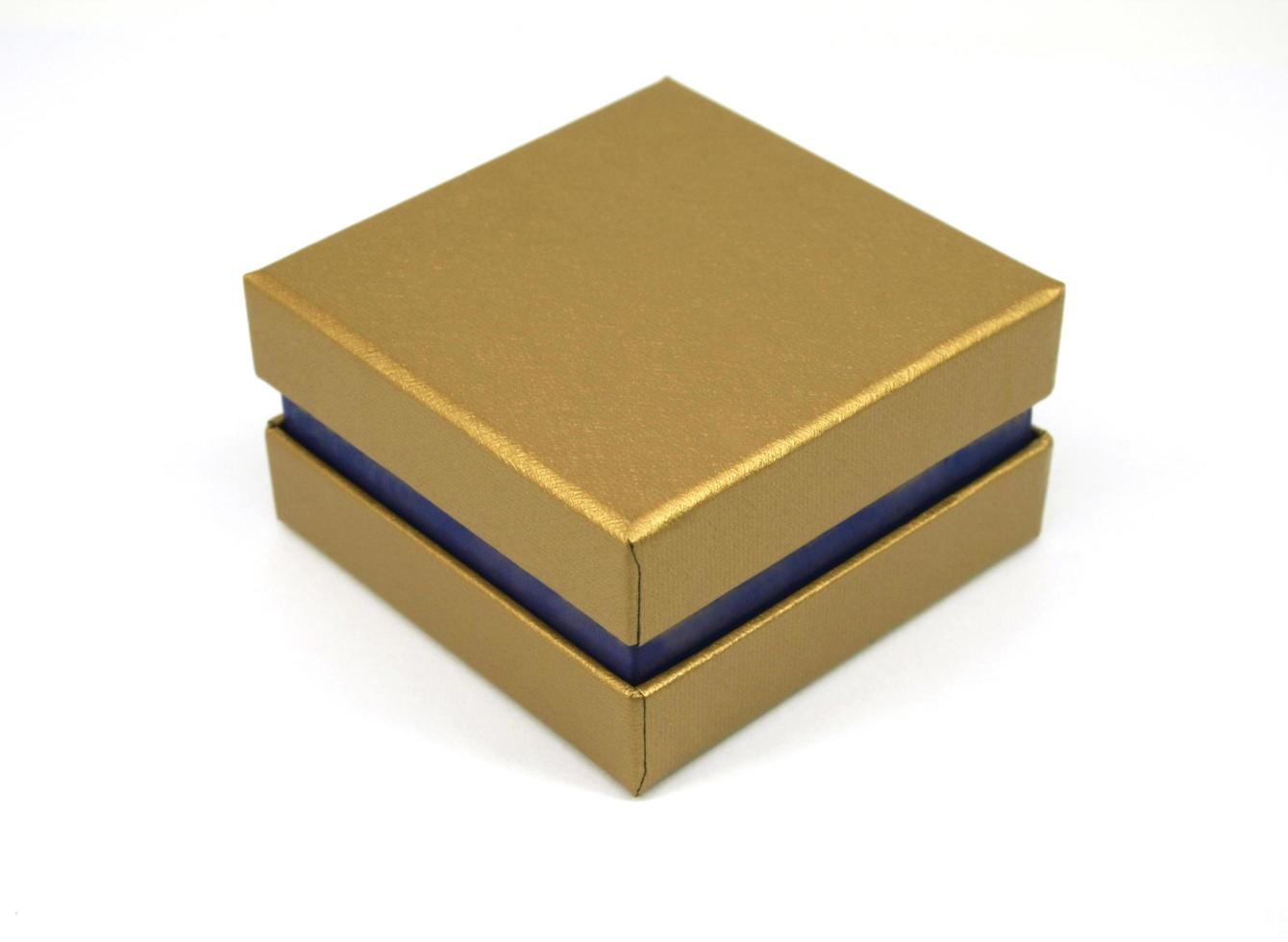 Golden gift box on white photo