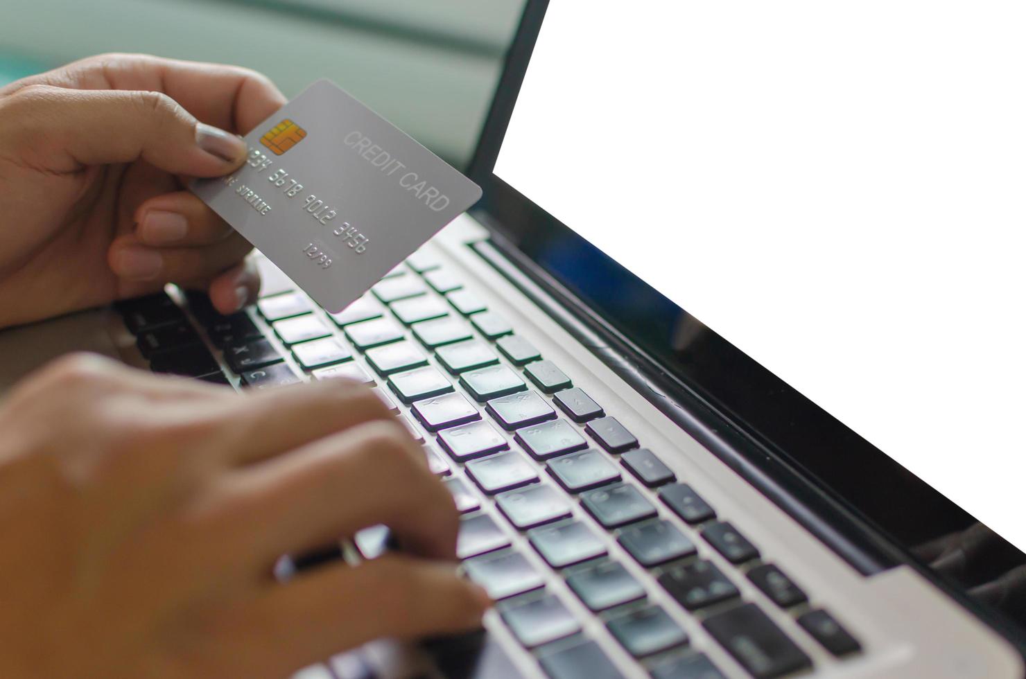 Person using credit card to shop online photo