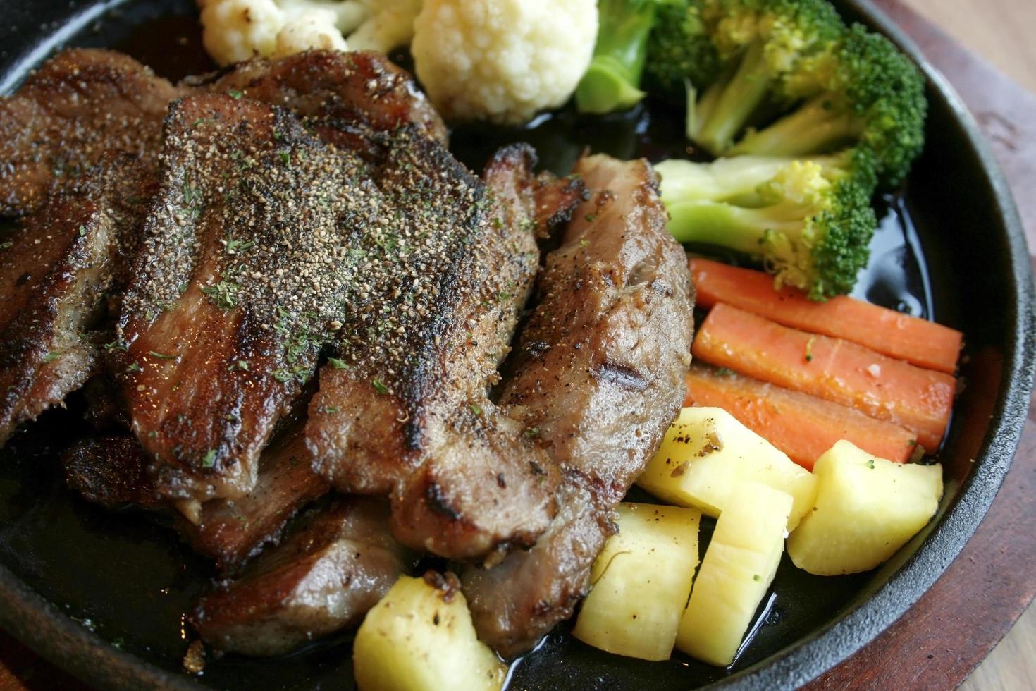 Grilled steaks and vegetable salad photo