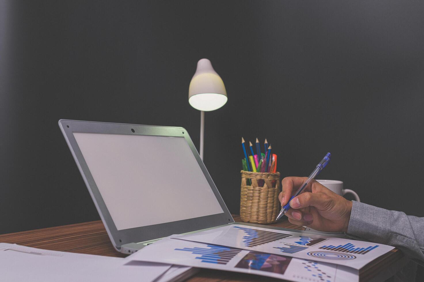 Business people sit at work and check documents At the desk in the room photo