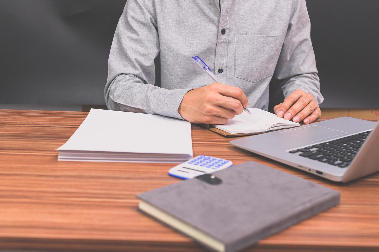 Business people sit at work and check documents At the desk in the room photo