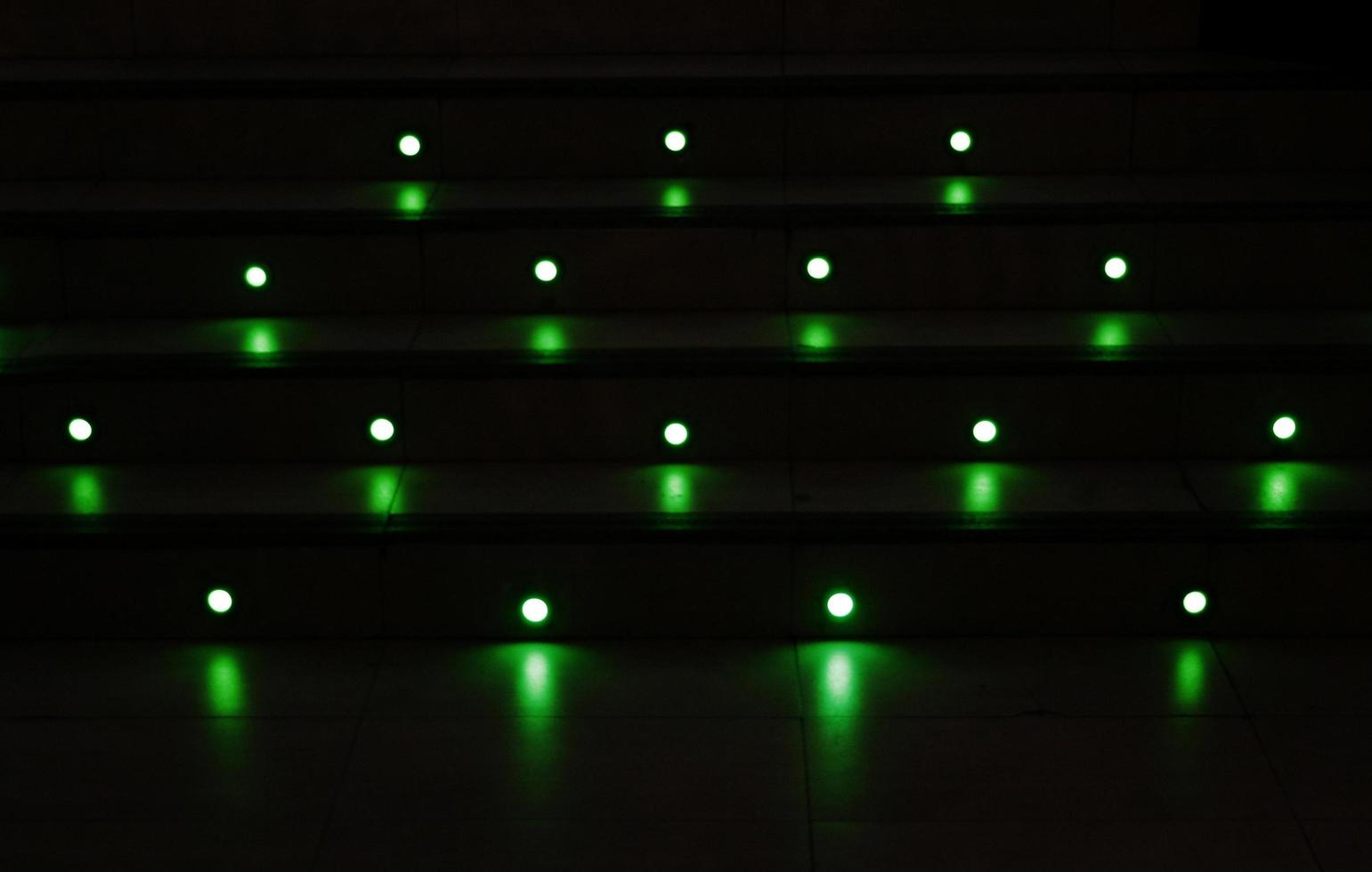 Green marbles on dark background photo