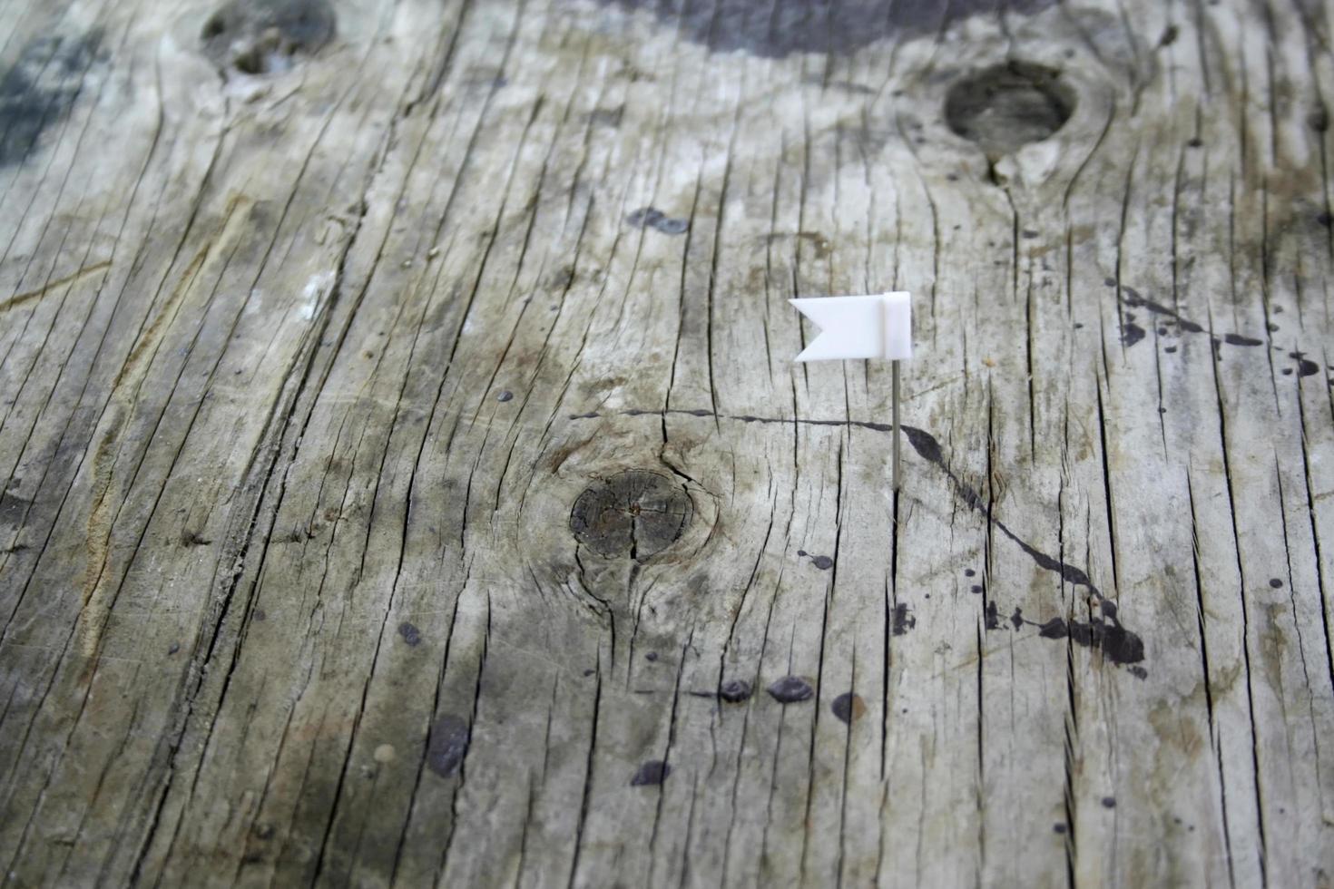 color flag pin on wooden photo