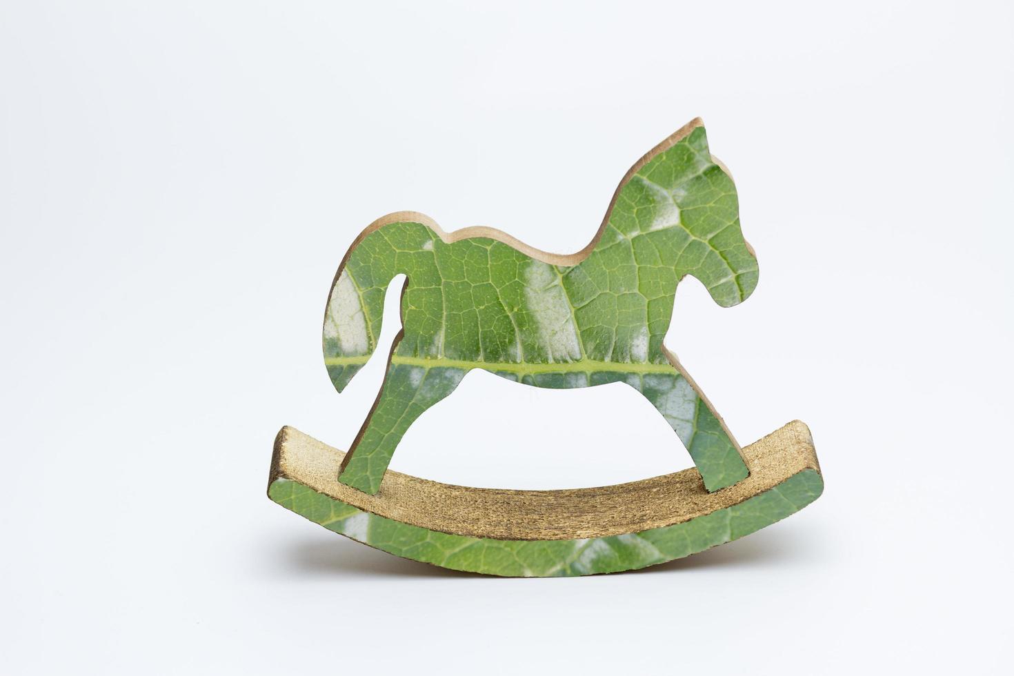A decorative rocking horse toy on a white background photo
