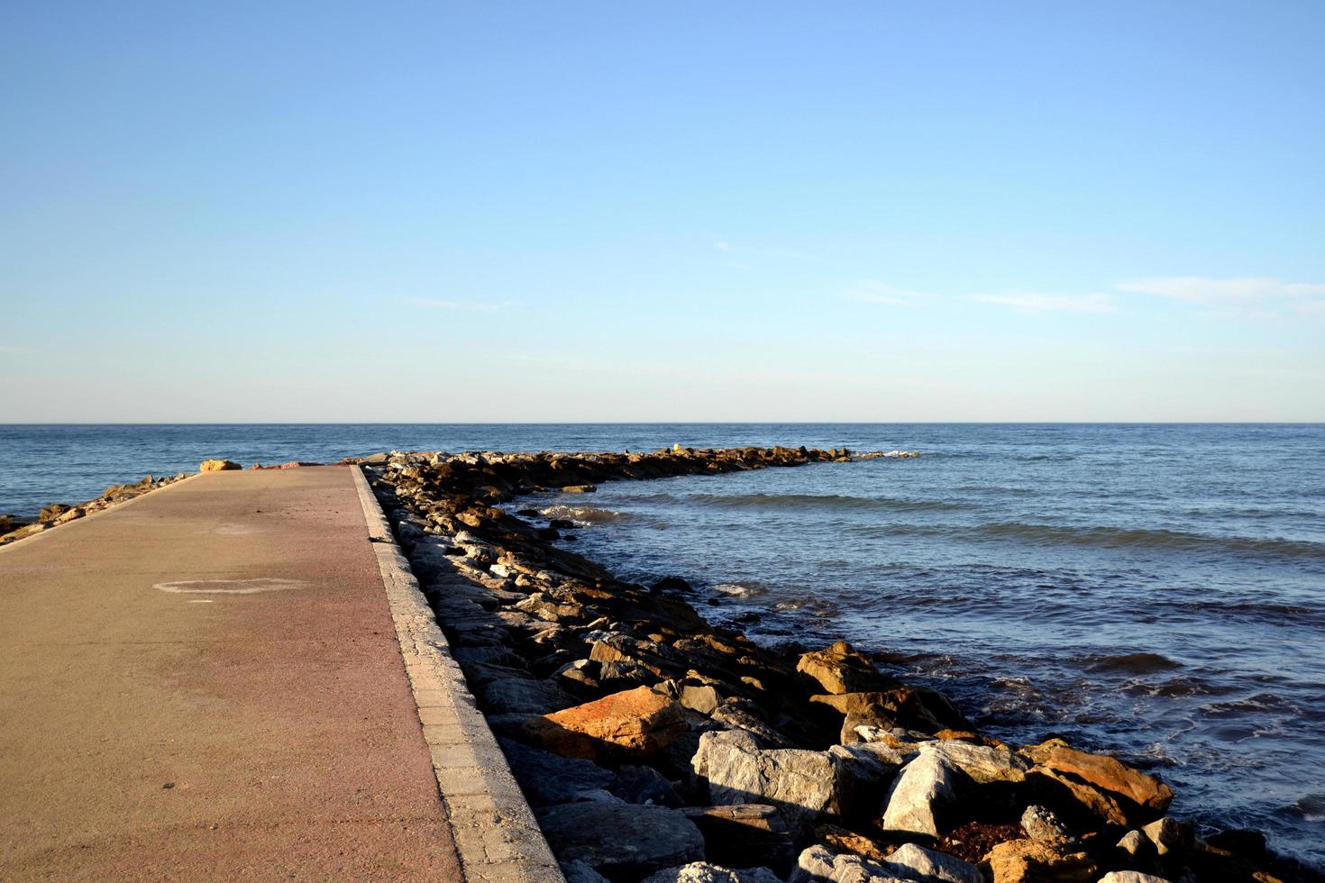 Spur on the beach to contain the blue sea photo