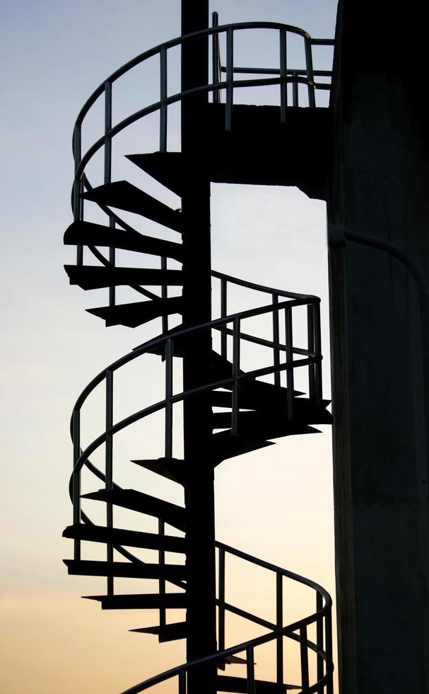 Spiral staircase at sunset photo