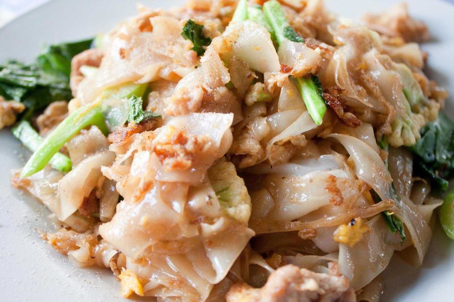 Thai fried noodles in a soy sauce with the pork photo