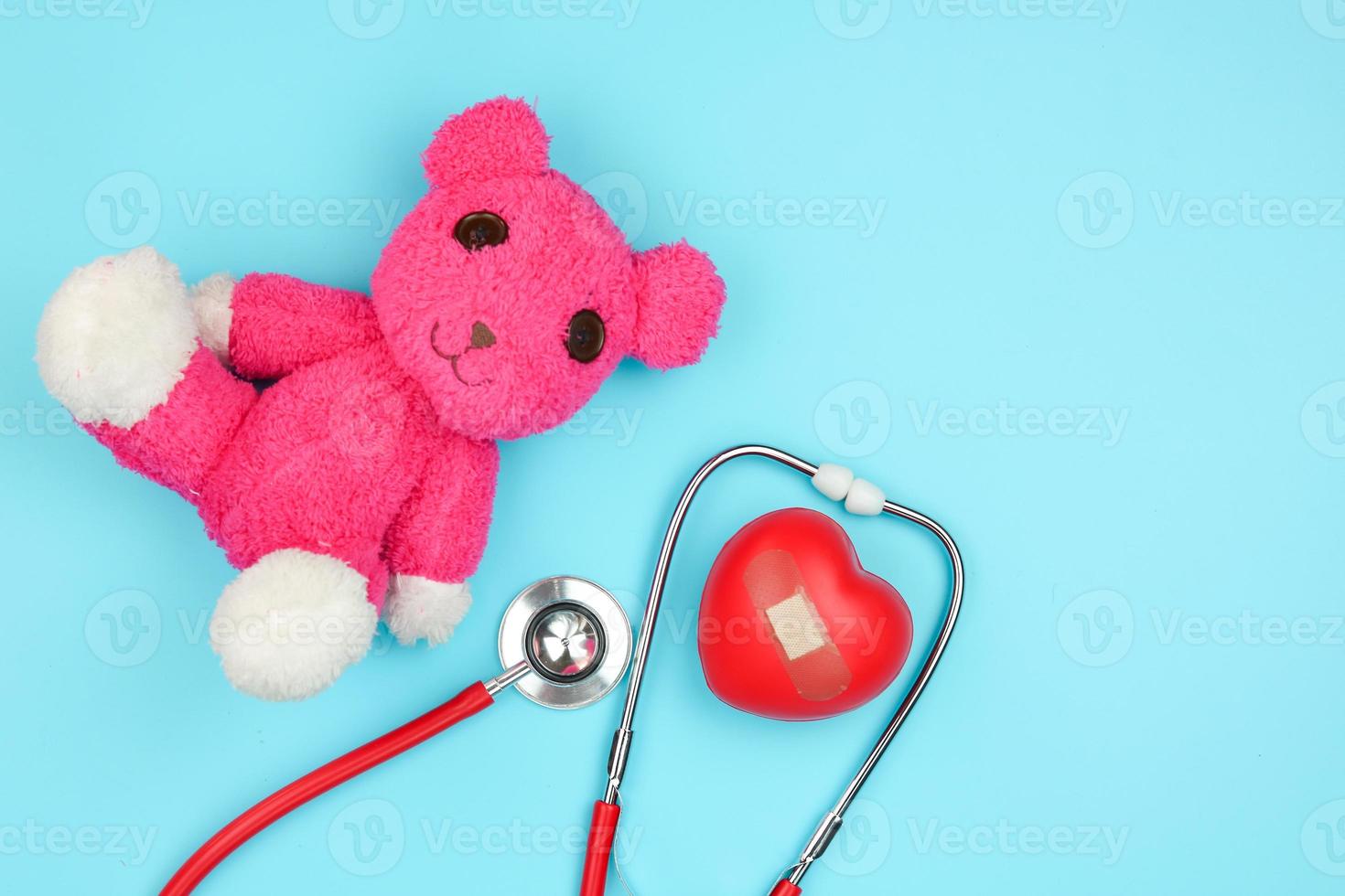 Stethoscope and stuffed bear photo