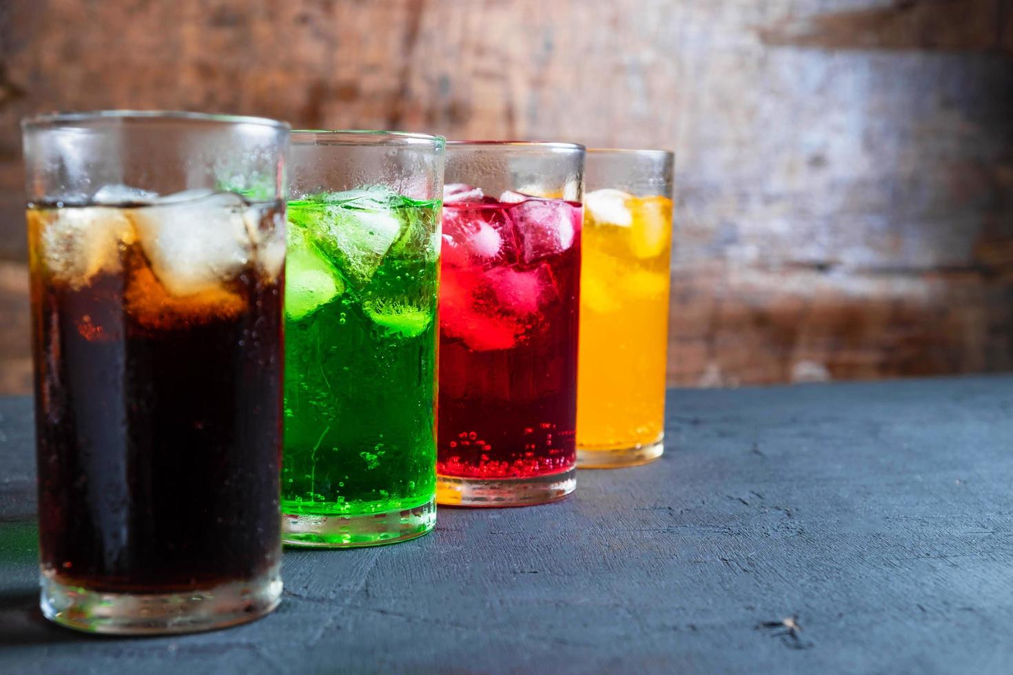 Soft drinks in the glass on the table photo