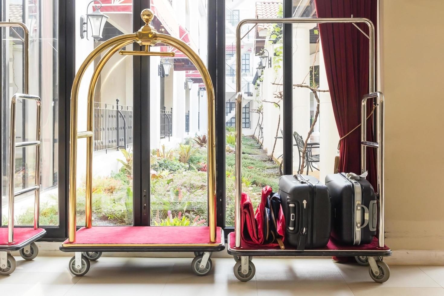 Hotel luggage carts near window photo