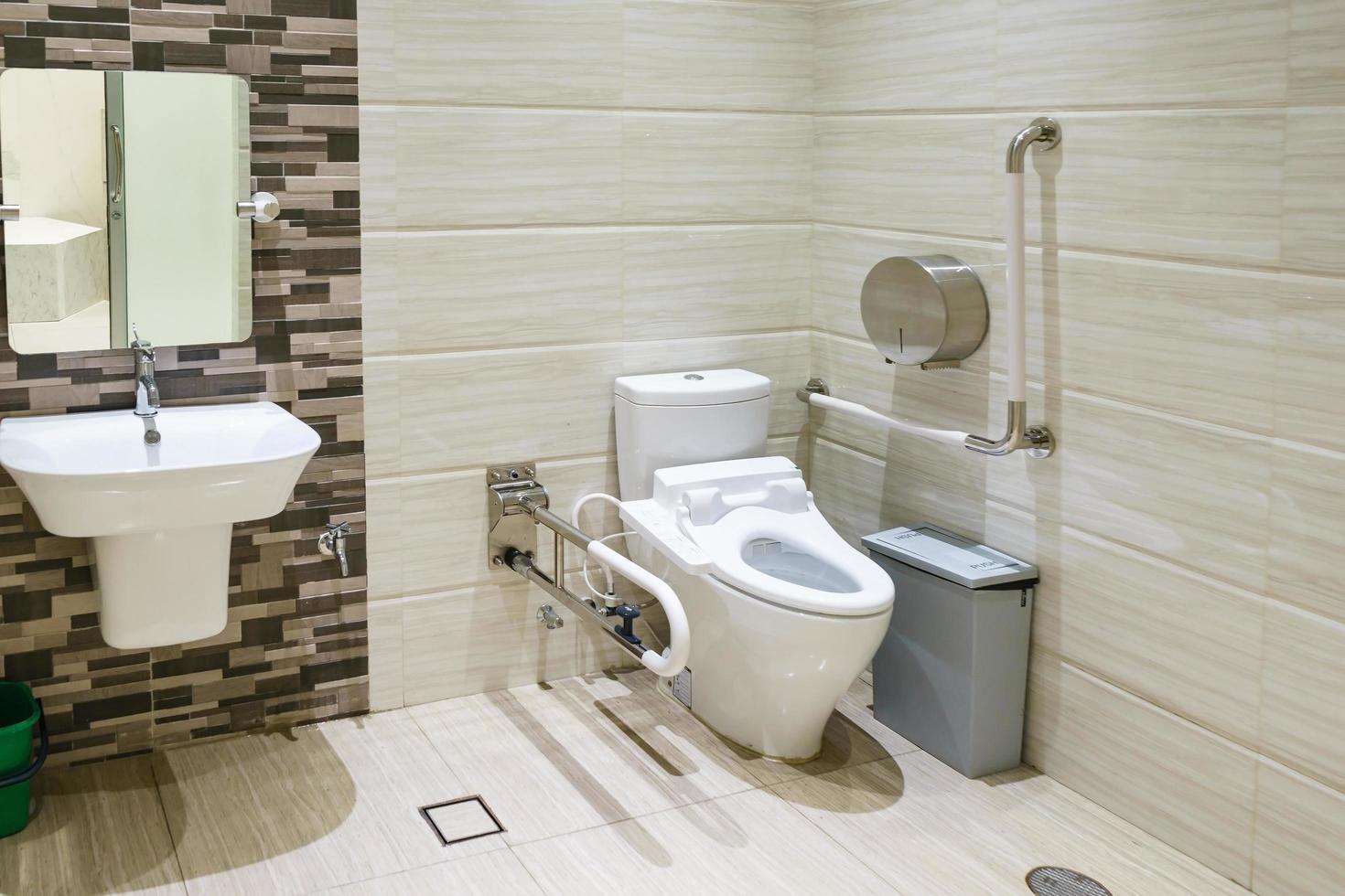 Interior of bathroom for the disabled or elderly people. Handrail for disabled and elderly people in the bathroom photo