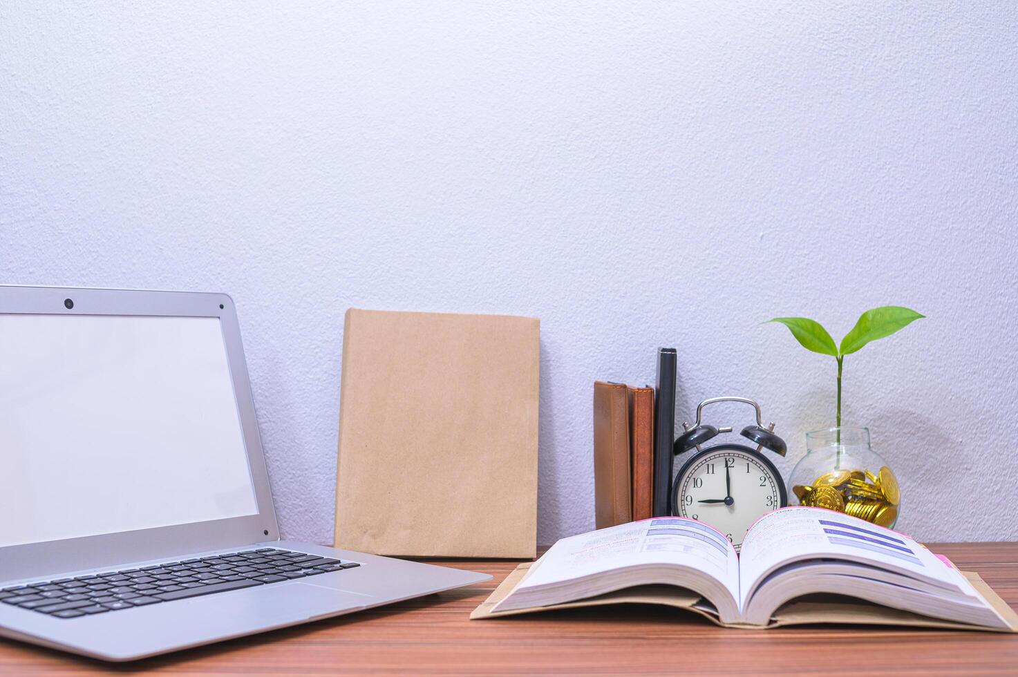 Laptop and other objects on the desk photo