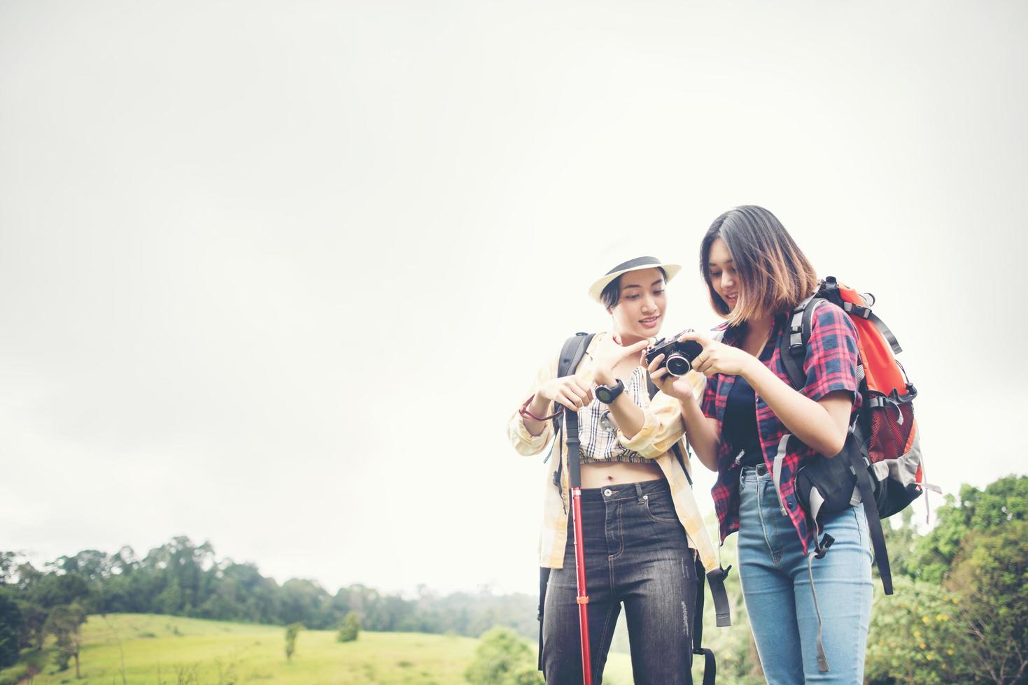 Two woman hiking to the mountain photo