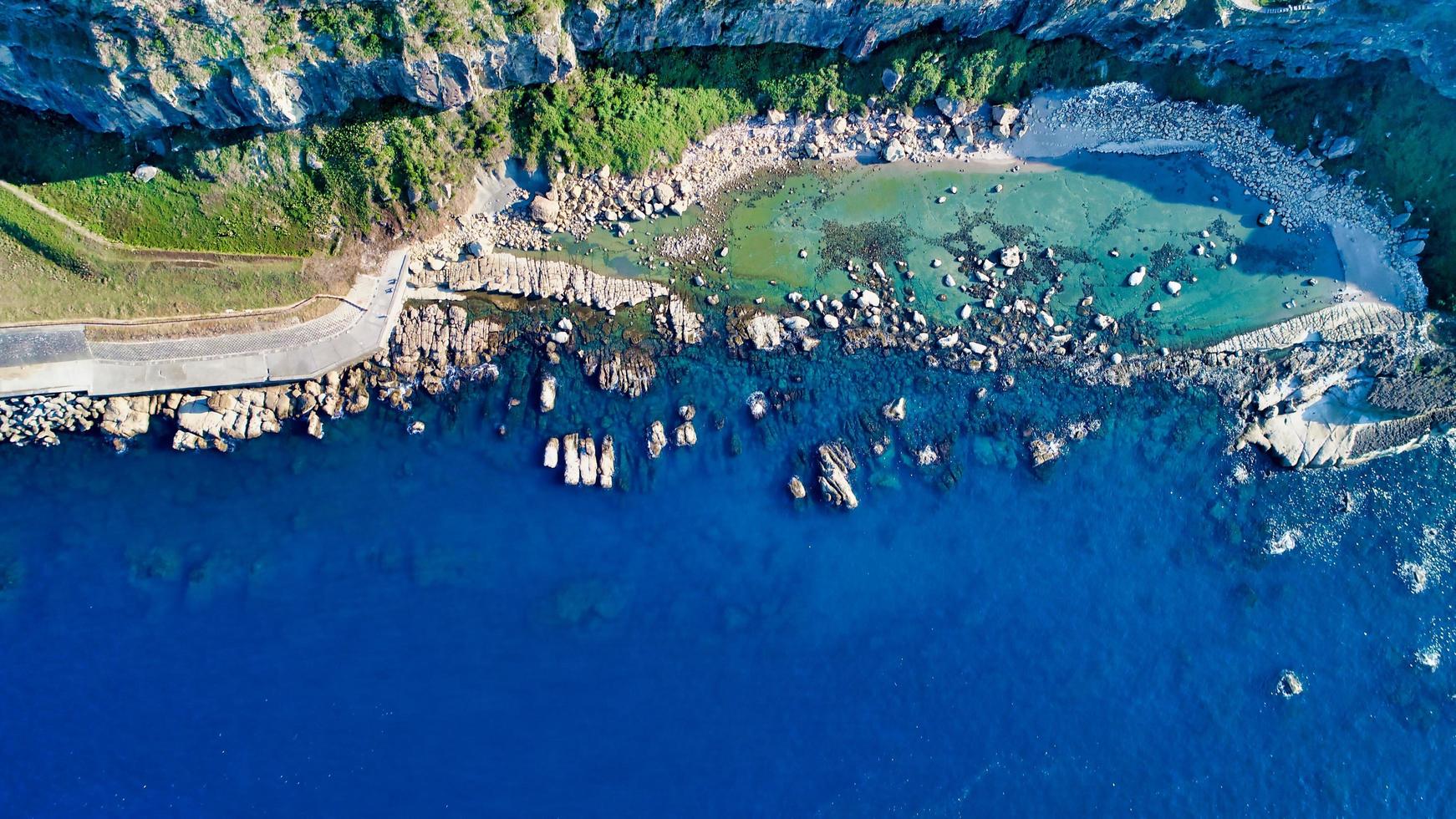 Aerial view of a city near the ocean photo