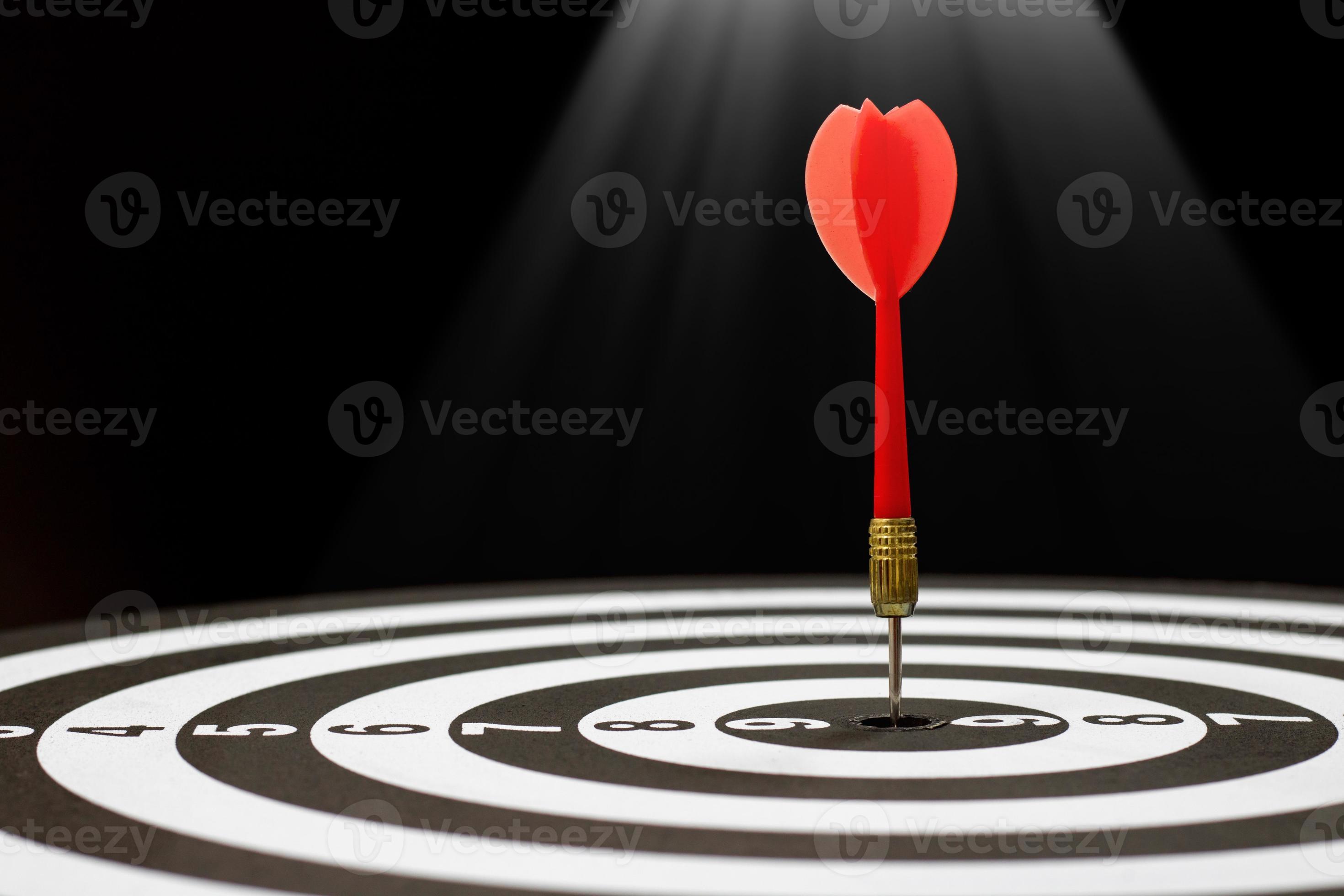 Dart hitting bullseye 1905603 Stock Photo at Vecteezy