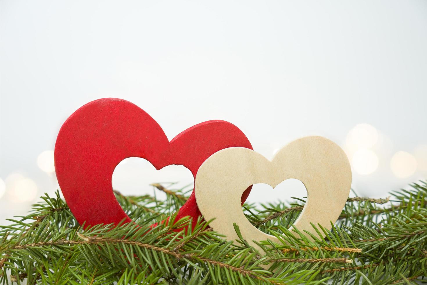 Wooden hearts on pine photo