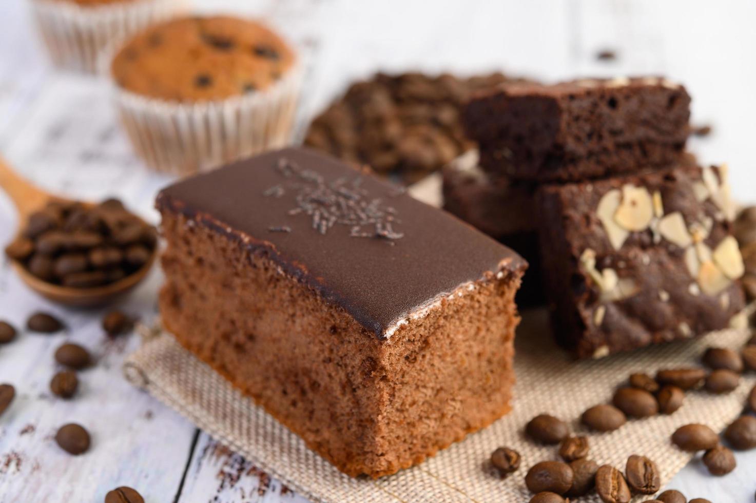 Chocolate cake with coffee beans on a wooden table photo