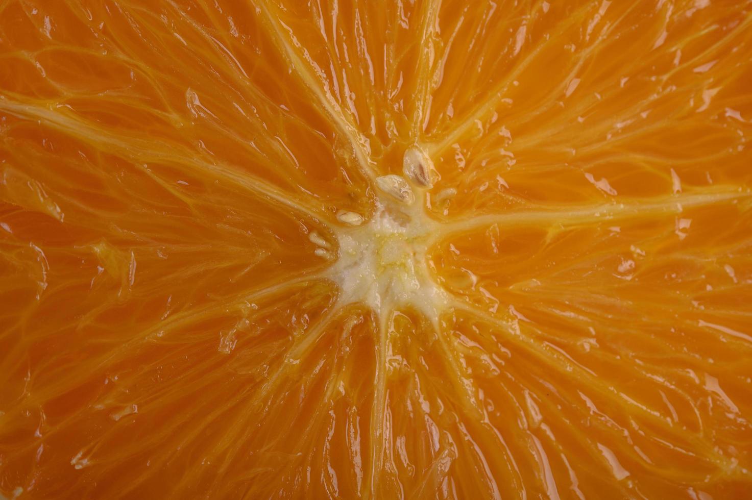 Imagen macro de naranja madura con poca profundidad de campo. foto