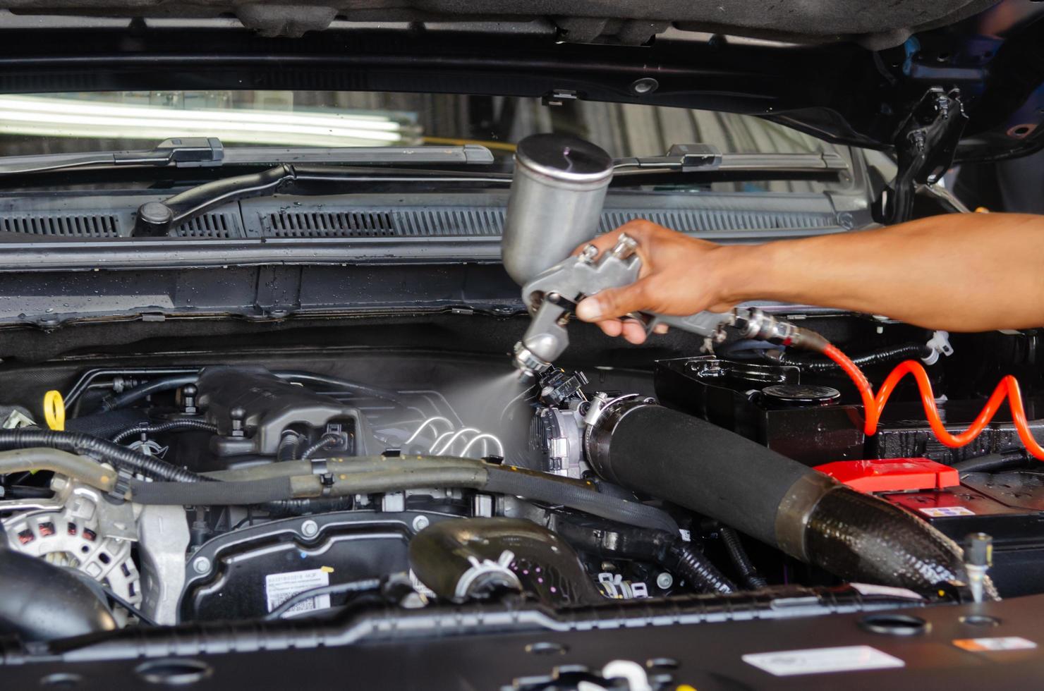 Car engineer doing maintenance photo