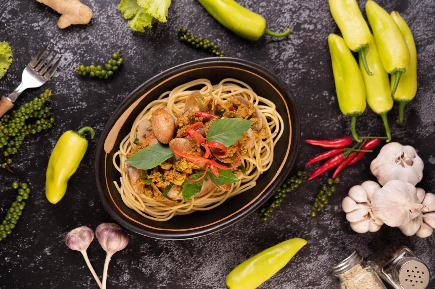 Spaghetti with clams with chilies, fresh garlic and pepper photo