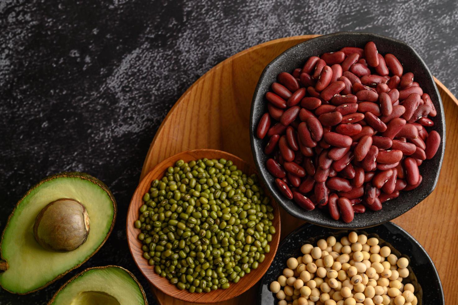 Legumes and fruit on a dark background photo