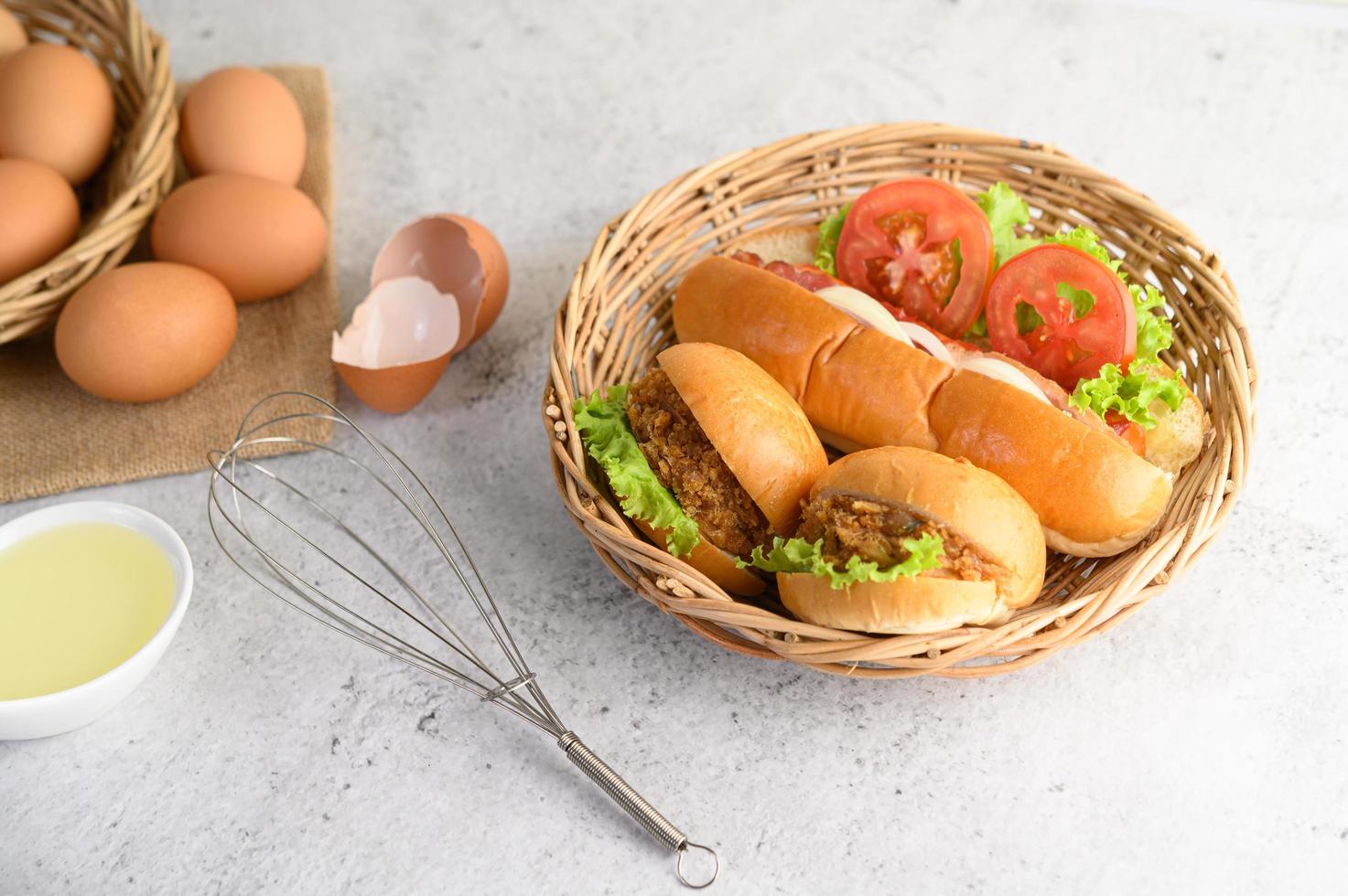 Fresh brown eggs and bakery products on a neutral background photo