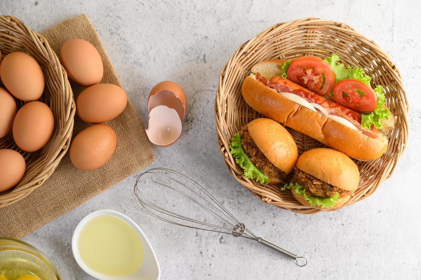 Fresh brown eggs and bakery products on a neutral background photo