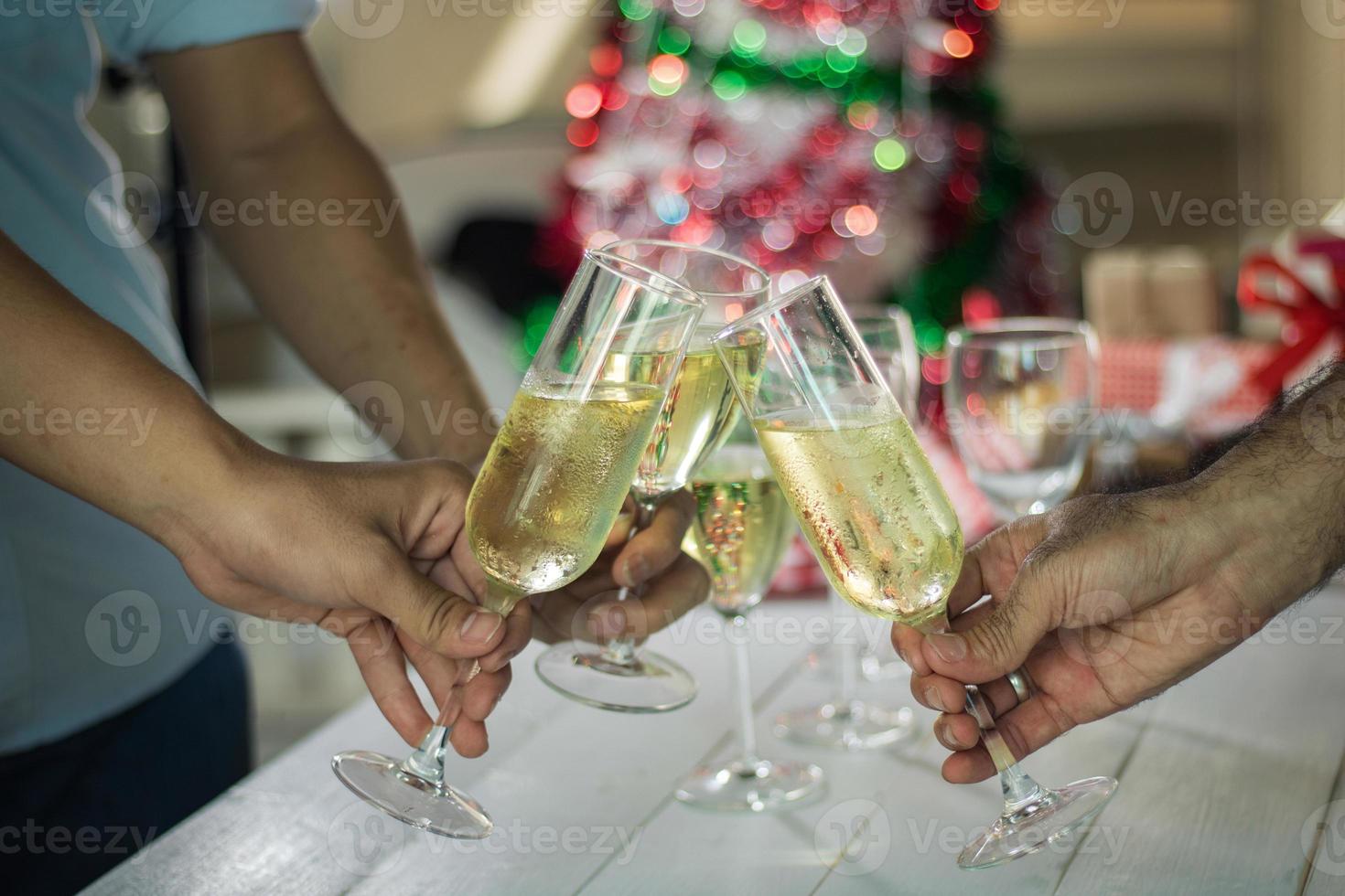 Group of people clinking glasses of champagne photo