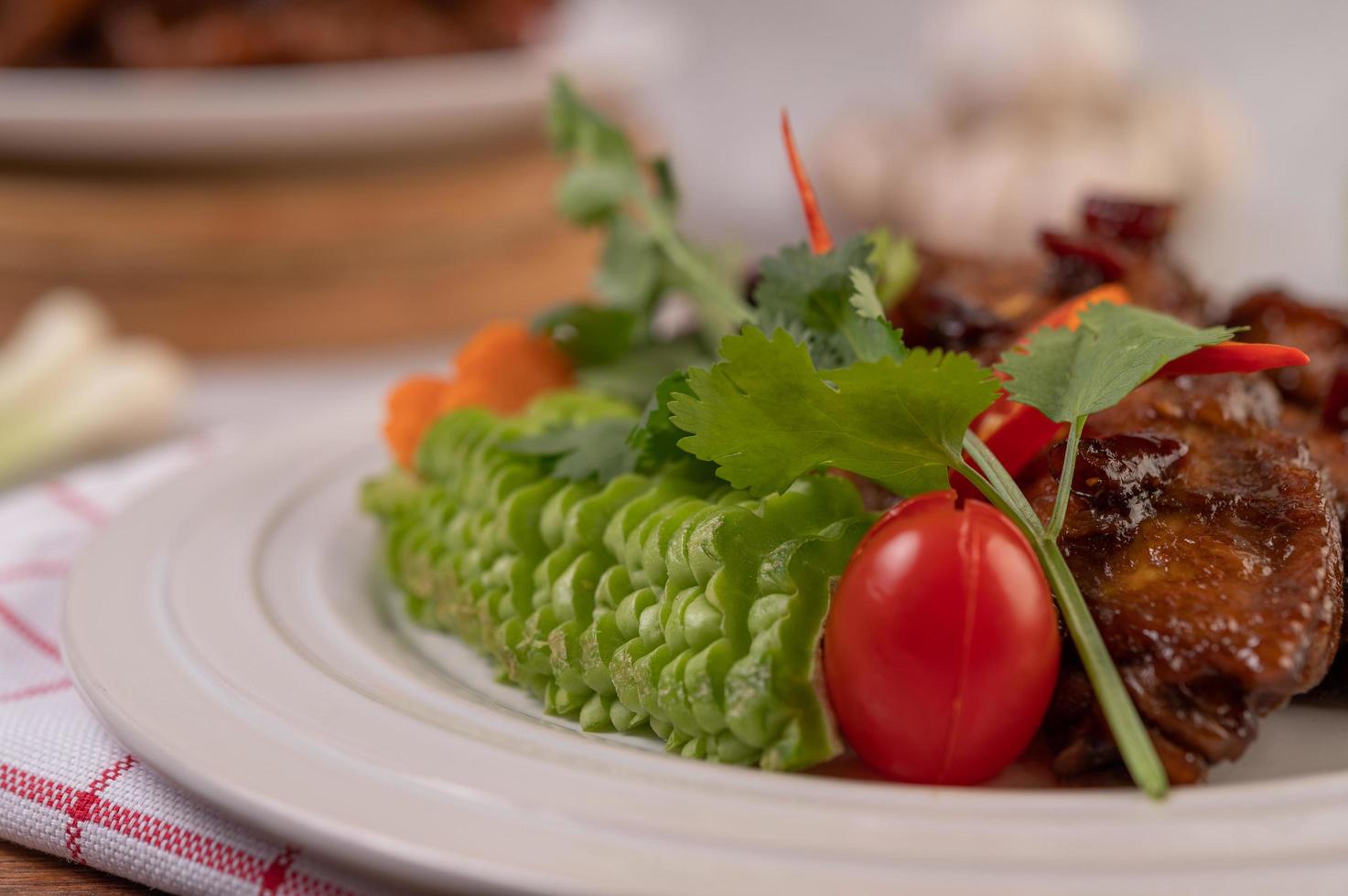 Sweet pork with chopped scallions, chili, lime, gourd, tomato and garlic photo