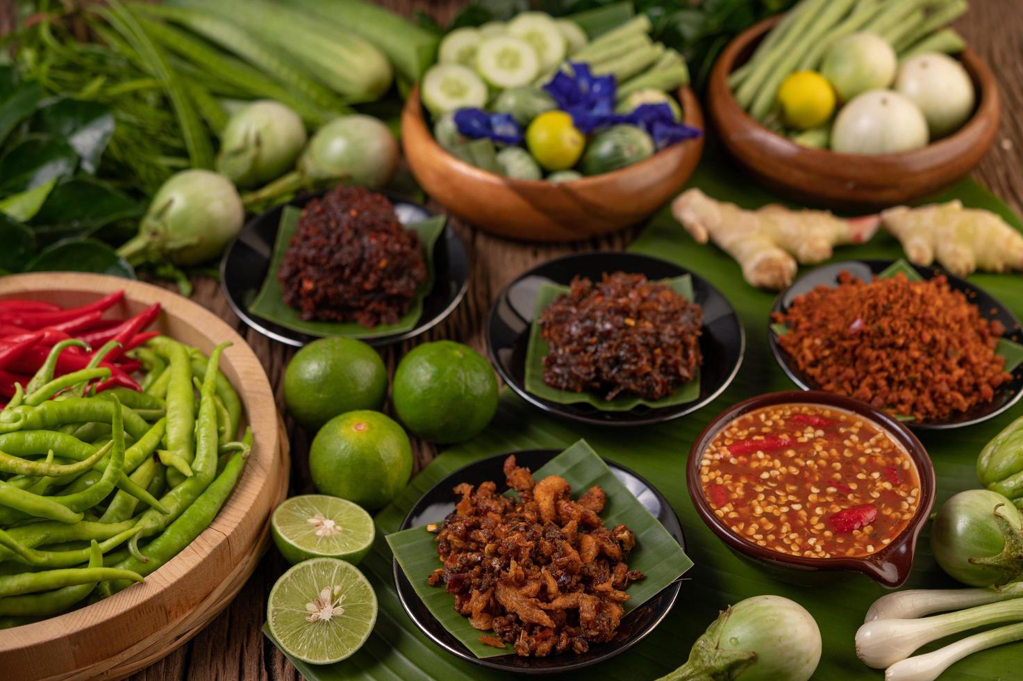 Different types of chili sauce with ingredients to make a Thai cuisine photo