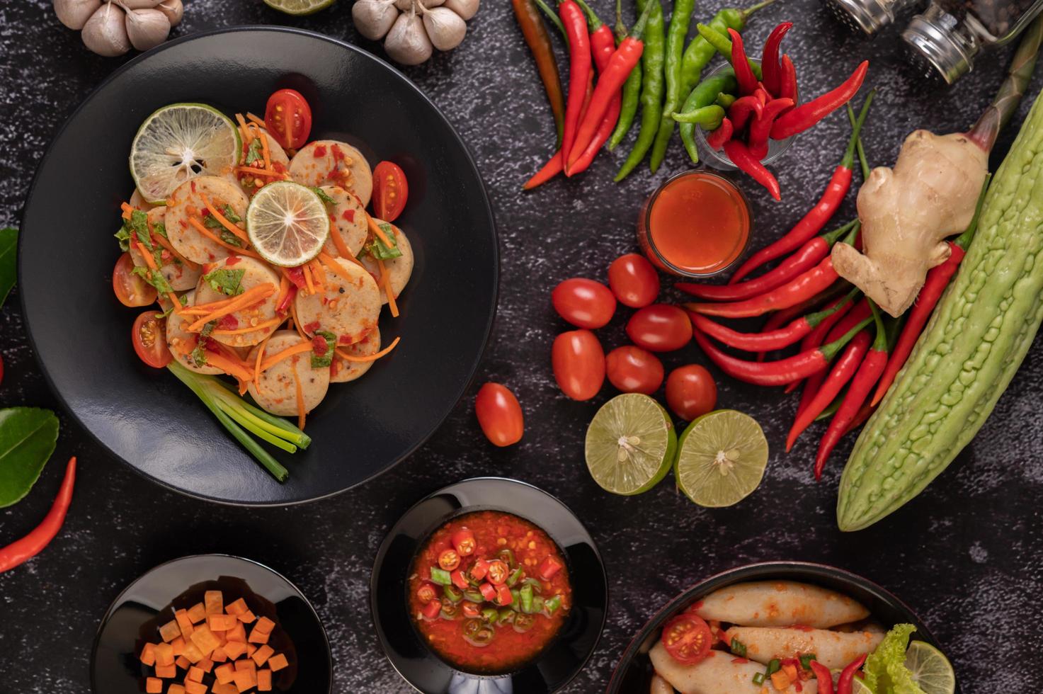 Vietnamese pork sausage salad with chilli, lemon, garlic and tomato photo