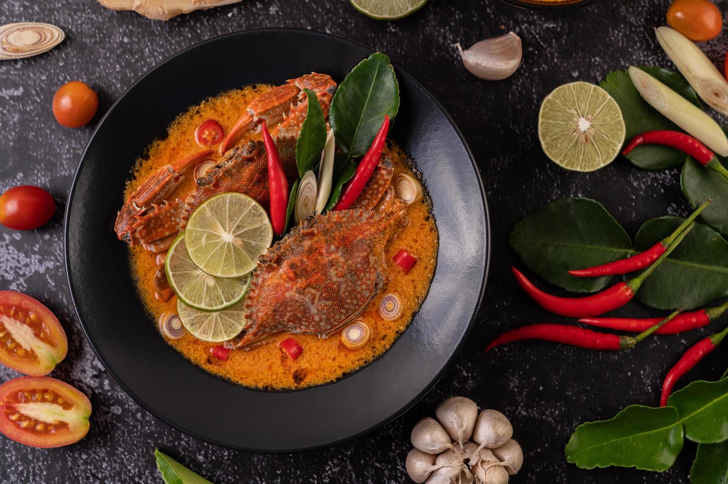 Tom yum crab with lemon, chili, tomato, garlic, lemongrass and kaffir lime photo