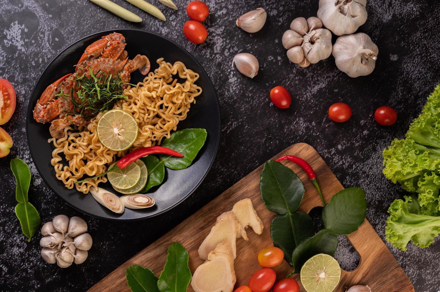 Crab with noodles and lemon, chili, tomato, garlic and lemongrass photo