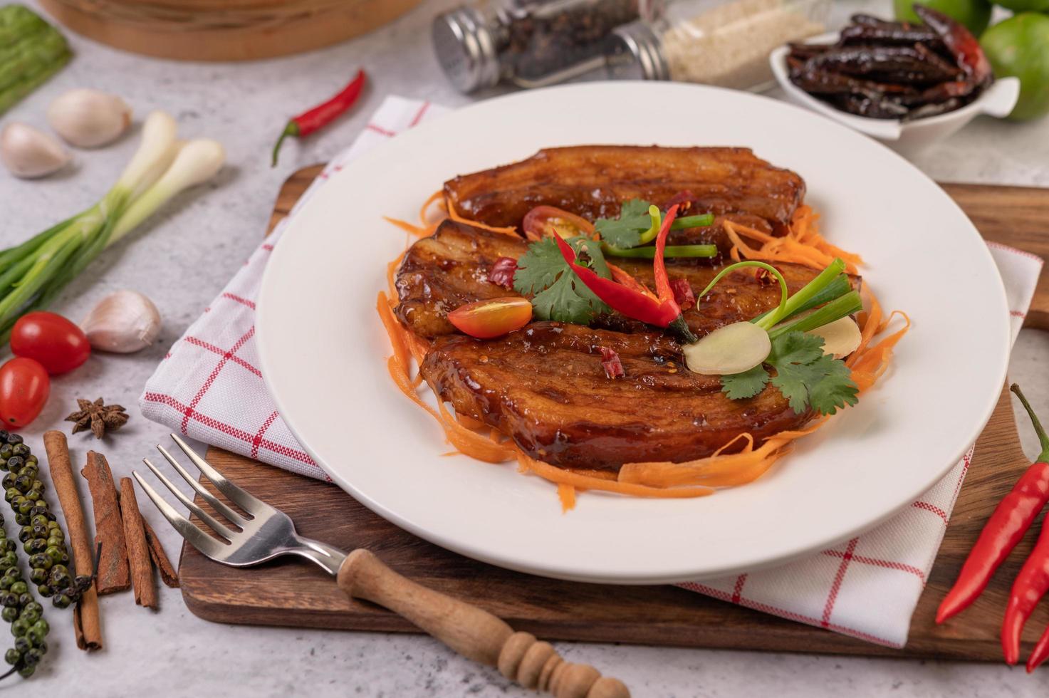 Sweet pork with chili, spring onions, carrots and coriander photo