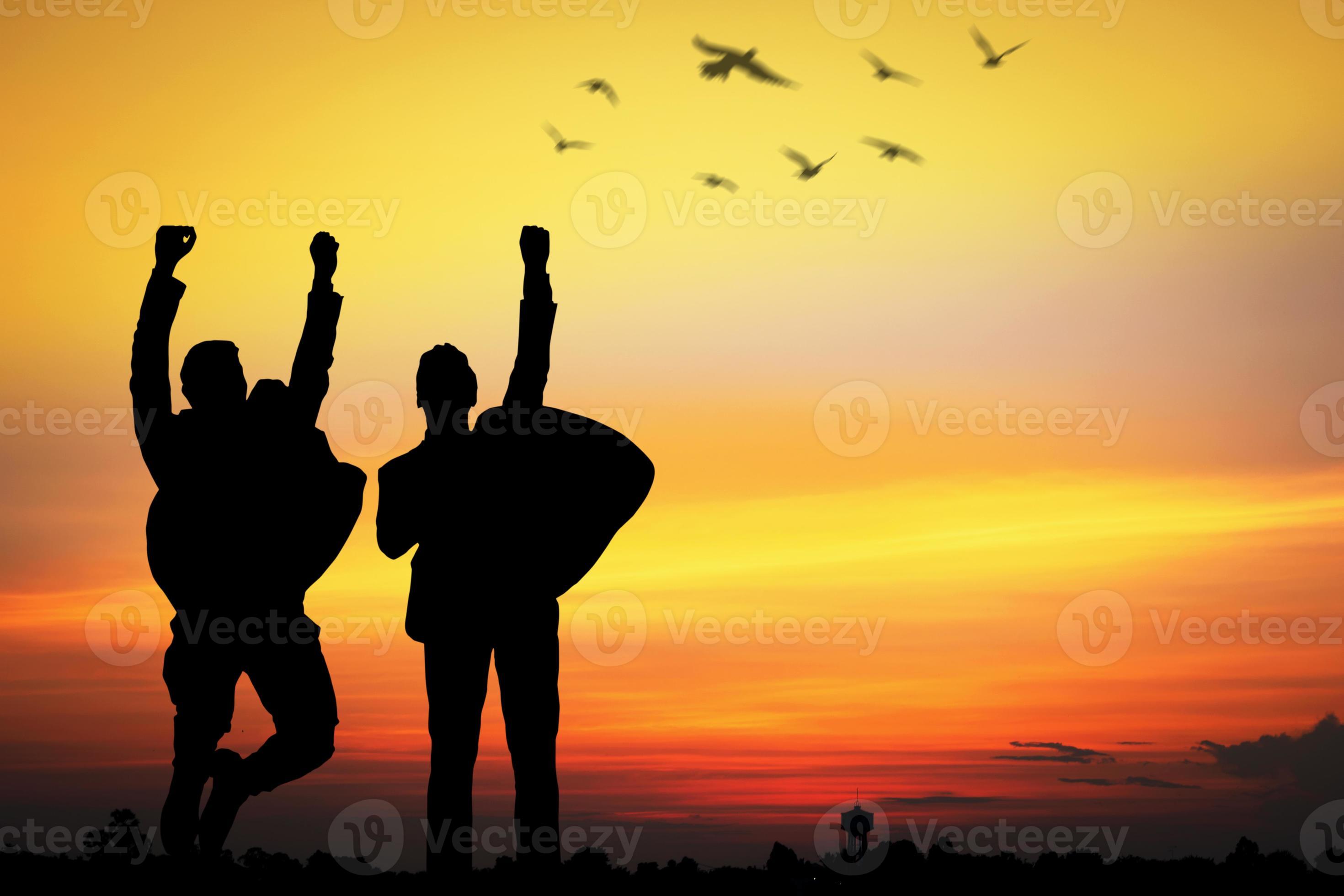 Silhouette of people cheering at sunset 1913951 Stock Photo at Vecteezy