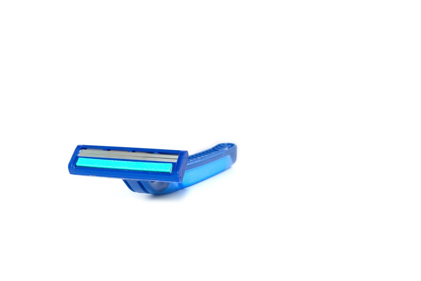 Blue razor on white background photo