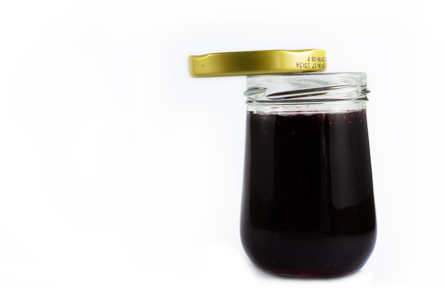 Glass of jam with lid photo